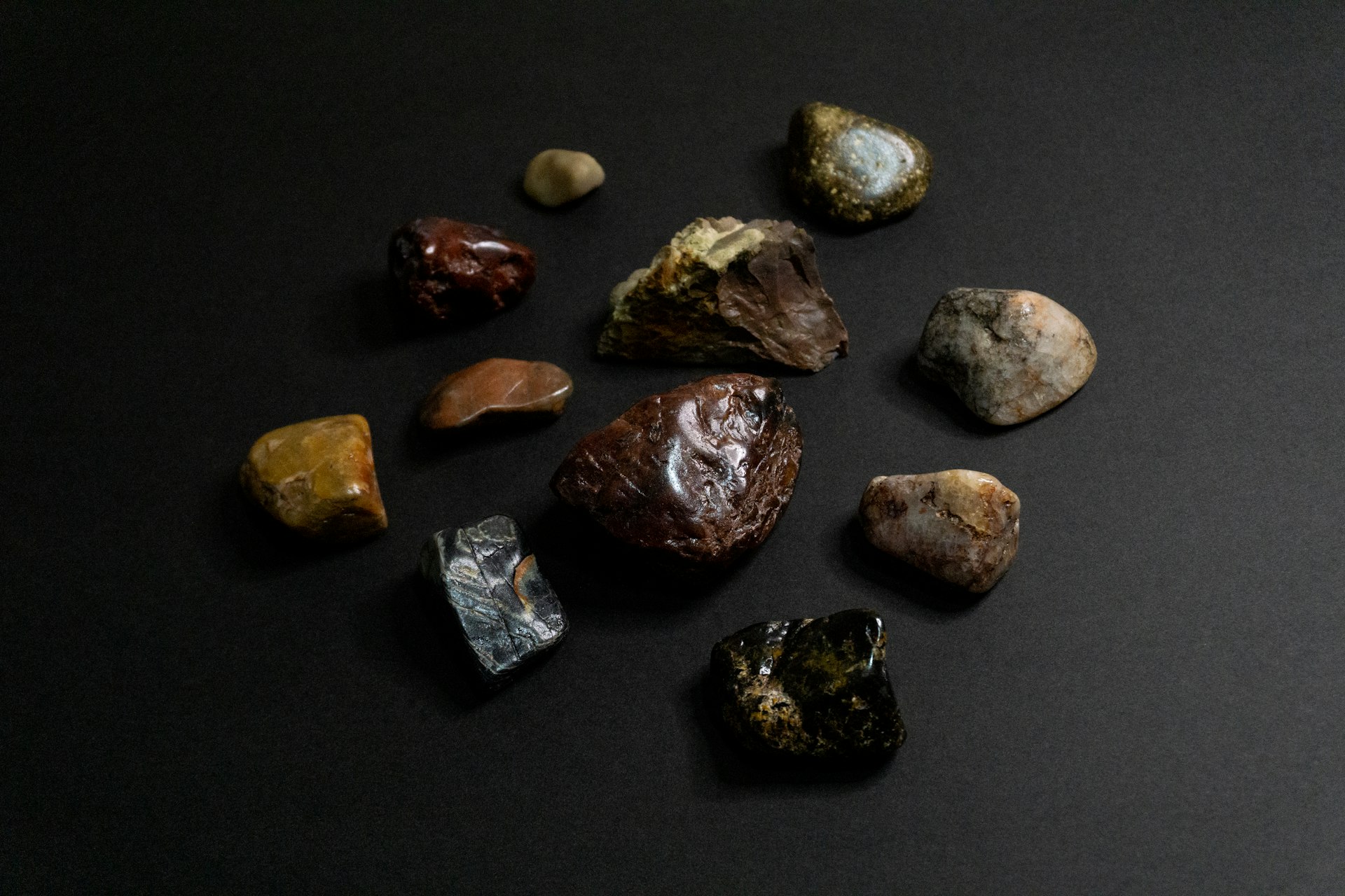 a group of rocks sitting on top of a black surface